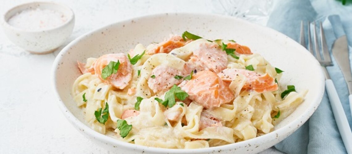 Honey salmon ribbon noodles with carrots